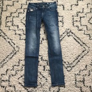 Medium wash Miss Me embellished skinny jeans